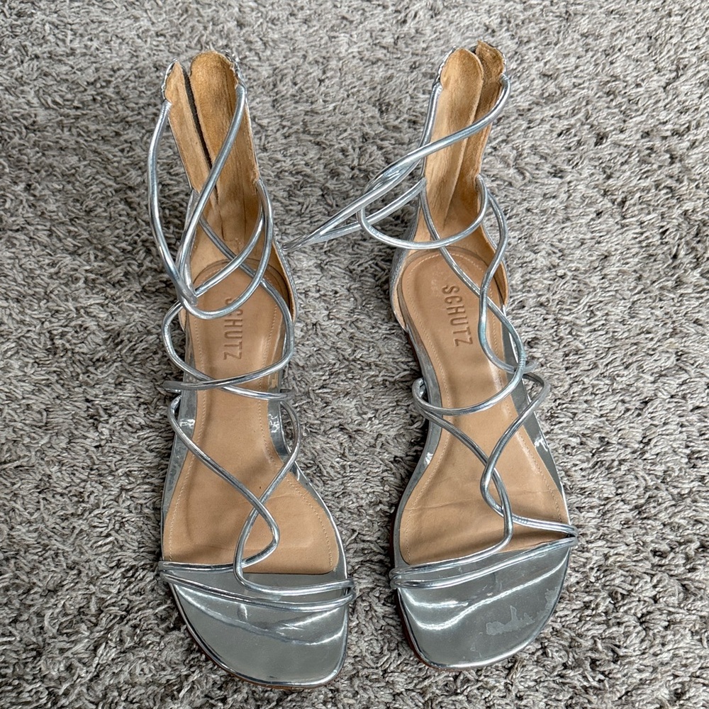 SCHUTZ Schutz Fabia Strappy Sandals in a metallic silver